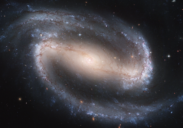 NASA’s Hubble Space Telescope Reveals Stunning Spiral Galaxy with Multiple Starburst Regions